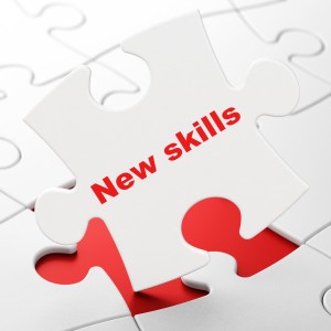 Education concept: New Skills on puzzle background